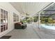 Screened in patio area with seating and view of the pool at 4030 Cool Water Ct, Winter Park, FL 32792