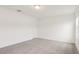 Clean bedroom with neutral carpet, white walls, a window, and a closet door at 4325 Switchgrass Ln, St Cloud, FL 34772
