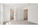 Cozy bedroom with carpet flooring and direct access to a walk-in closet and en-suite bathroom at 4325 Switchgrass Ln, St Cloud, FL 34772
