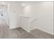 Upstairs landing with carpet and a view to another room at 4325 Switchgrass Ln, St Cloud, FL 34772