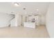Spacious open-concept living area with tile flooring and recessed lighting throughout at 4325 Switchgrass Ln, St Cloud, FL 34772