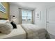Well-lit bedroom with neutral tones, comfortable bedding, and a serene ambiance for a peaceful retreat at 490 Belmond Dr, Debary, FL 32713