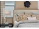 Tasteful bedroom with a stylish bed and natural light from the window at 490 Belmond Dr, Debary, FL 32713