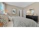 Relaxing bedroom with a patterned bedspread and ambient lighting at 490 Belmond Dr, Debary, FL 32713