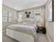 Comfortable bedroom featuring a bed, matching nightstands, and decorative accents at 490 Belmond Dr, Debary, FL 32713
