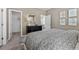Bedroom view with a dresser, bedside tables, and plenty of natural light at 490 Belmond Dr, Debary, FL 32713