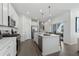 Well-appointed kitchen with stainless steel appliances, a central island with bar seating, and an open layout to the backyard patio at 490 Belmond Dr, Debary, FL 32713