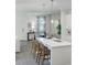 Modern kitchen island with bar seating, seamlessly connected to the dining area and living space at 490 Belmond Dr, Debary, FL 32713