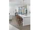 Bright and modern kitchen island with seating, adjacent to a dining area and living space at 490 Belmond Dr, Debary, FL 32713
