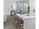 Modern kitchen island with bar seating, seamlessly connected to the dining area and living space at 490 Belmond Dr, Debary, FL 32713