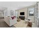 Bright and stylish living room featuring modern furniture, stylish décor, and large windows for natural light at 490 Belmond Dr, Debary, FL 32713