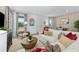 Bright and inviting living room featuring a comfortable sectional sofa, stylish decor, and large windows at 490 Belmond Dr, Debary, FL 32713