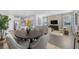 Spacious living and dining area with modern furnishings and an open-concept design at 490 Belmond Dr, Debary, FL 32713
