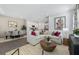 Open-concept living area with modern furnishings, seamlessly connecting the living room to the kitchen and dining space at 490 Belmond Dr, Debary, FL 32713