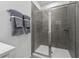 Modern shower with gray tiling and glass enclosure at 490 Belmond Dr, Debary, FL 32713