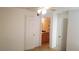 A bedroom features a ceiling fan, carpet, and an open doorway to the bathroom at 5160 Conroy Rd # 1437, Orlando, FL 32811