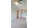 Cozy living space featuring neutral colors, an open closet door, and a pendant light fixture creating an inviting atmosphere at 5160 Conroy Rd # 1437, Orlando, FL 32811