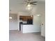 Comfortable living space with combined kitchen area, featuring modern appliances and an open layout at 5160 Conroy Rd # 1437, Orlando, FL 32811