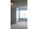 Bright living room with ceiling fan and multiple windows, flooding the space with natural light and creating an airy feel at 5160 Conroy Rd # 1437, Orlando, FL 32811