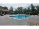 Community pool perfect for relaxing with an abundance of lounge chairs and serene views at 5160 Conroy Rd # 1437, Orlando, FL 32811