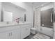 Modern bathroom with double vanity sinks, stylish shower-tub combination, and neutral color scheme at 558 Orient Ave, Debary, FL 32713