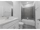 Modern bathroom with tiled shower, white vanity, and elegant fixtures for a luxurious feel at 558 Orient Ave, Debary, FL 32713