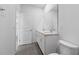 Bright bathroom features double sinks, a large mirror, and tile flooring at 558 Orient Ave, Debary, FL 32713