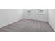 Bright bedroom featuring neutral walls, plush carpet, and window at 558 Orient Ave, Debary, FL 32713