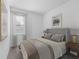Cozy bedroom with plush carpet, large window, and tastefully decorated in neutral tones at 558 Orient Ave, Debary, FL 32713