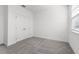 Bright bedroom features neutral carpet, white walls, closet, and a window for ample natural light at 558 Orient Ave, Debary, FL 32713
