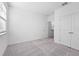 Bright bedroom with neutral carpet, white walls, closet, and natural light at 558 Orient Ave, Debary, FL 32713