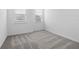 Bright bedroom featuring neutral carpet, white walls, and natural light at 558 Orient Ave, Debary, FL 32713