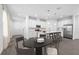 Spacious kitchen with white cabinetry, stainless steel appliances, and center island with seating at 558 Orient Ave, Debary, FL 32713