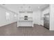 Charming kitchen features stainless appliances, white cabinets, a center island, and hard surface floors at 558 Orient Ave, Debary, FL 32713