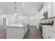 Charming kitchen features stainless appliances, white cabinets, a center island and a gas cooktop at 558 Orient Ave, Debary, FL 32713
