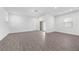 Spacious living room with wood-look floors, recessed lighting, and access to the outdoors at 558 Orient Ave, Debary, FL 32713