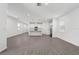 Expansive living room with wood-look floors and kitchen island, bathed in natural light at 558 Orient Ave, Debary, FL 32713