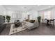 Bright living room with modern furnishings, wood floors, and view to a dining area at 558 Orient Ave, Debary, FL 32713