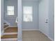 Inviting entryway featuring tile flooring, a staircase, and a bright, airy ambiance at 5843 Strada Capri Way, Orlando, FL 32835