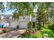 Charming two-story home featuring a two-car garage, brick driveway, and well-manicured landscaping at 5843 Strada Capri Way, Orlando, FL 32835