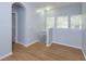 Upstairs hallway featuring natural light and wood floors leading to rooms at 5843 Strada Capri Way, Orlando, FL 32835