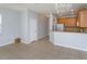 Bright and spacious living area featuring tile floors, open concept design, with view of kitchen at 5843 Strada Capri Way, Orlando, FL 32835