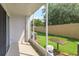 Enclosed patio showing backyard, providing an excellent view and shade at 5843 Strada Capri Way, Orlando, FL 32835