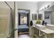Modern bathroom with sleek fixtures and view into an adjacent bedroom at 6001 Westgate Dr # 2124, Orlando, FL 32835