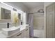 Bathroom featuring double sinks, modern fixtures, and a shower-tub combination at 6001 Westgate Dr # 2124, Orlando, FL 32835