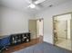 Bedroom featuring a desk, chair, large storage unit, and hardwood floors at 6001 Westgate Dr # 2124, Orlando, FL 32835