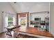 Modern kitchen featuring white cabinets, stainless steel appliances, brick wall and hardwood countertop island with seating at 6001 Westgate Dr # 2124, Orlando, FL 32835