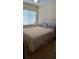 Bright bedroom with natural light, featuring a bed with plush bedding at 602 Hillcrest Dr, Davenport, FL 33897