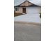 Single-Gathering home with a two-car garage and a spacious driveway at 602 Hillcrest Dr, Davenport, FL 33897