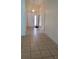 Inviting foyer with tile flooring and a stylish light fixture at 602 Hillcrest Dr, Davenport, FL 33897